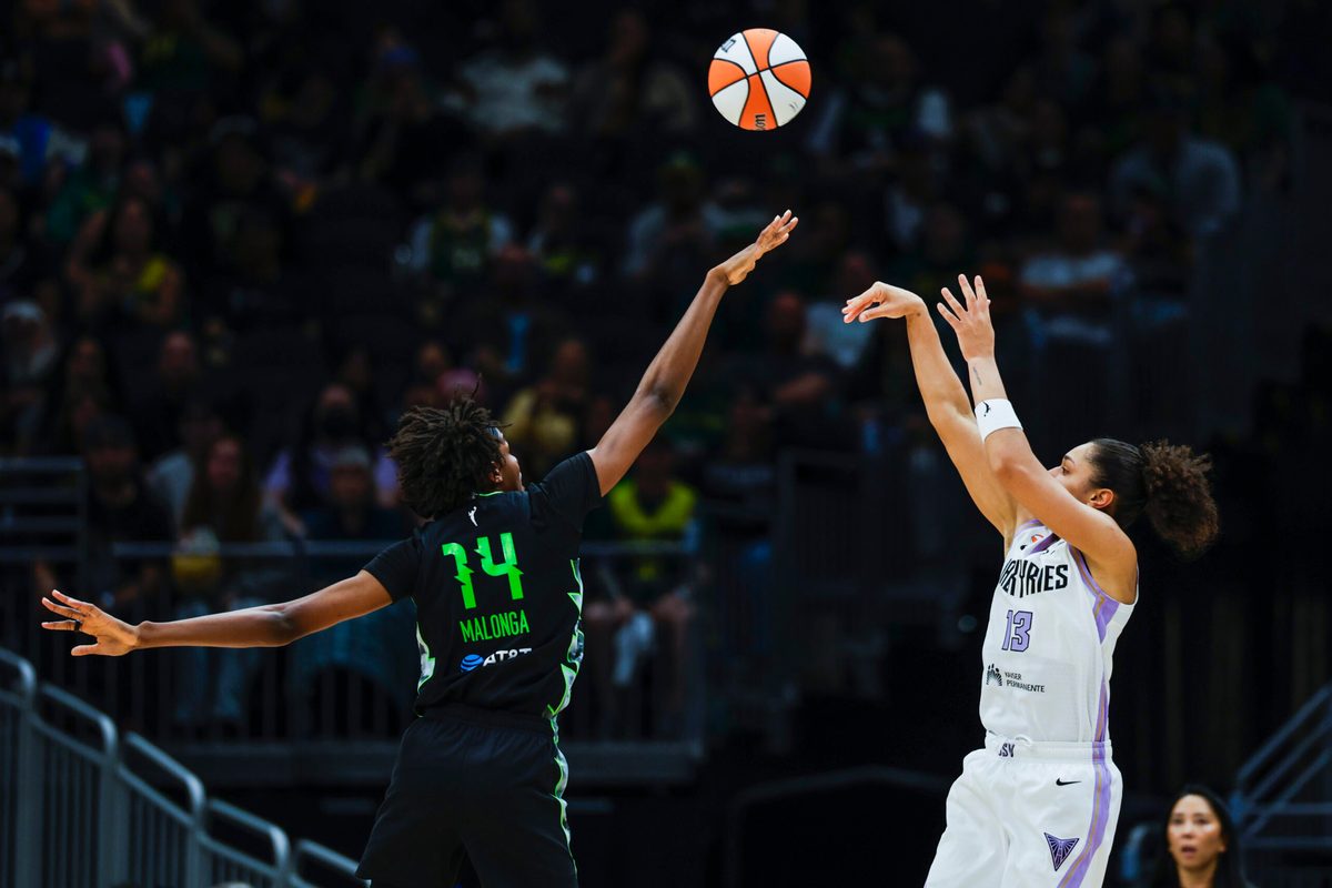 May 8, 2026; Seattle, Washington, USA; Golden State Valkyries forward Janelle Salaun (13) shoots against Seattle Storm center Dominique Malonga (14) during the third quarter at Climate Pledge Arena. Mandatory Credit: Joe Nicholson-Imagn Images