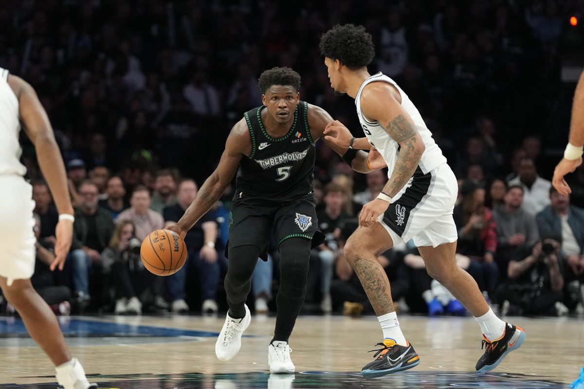 May 8, 2026; Minneapolis, Minnesota, USA; Minnesota Timberwolves guard Anthony Edwards (5) dribbles against the San Antonio Spurs guard Dylan Harper (2) in the second half during game three of the second round of the 2026 NBA Playoffs at Target Center. Mandatory Credit: Jesse Johnson-Imagn Images