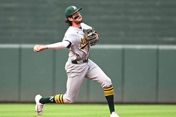 May 9, 2026; Baltimore, Maryland, USA; Athletics shortstop Jacob Wilson (5) throws to first base during the first inning against the Baltimore Orioles at Oriole Park at Camden Yards. Mandatory Credit: James A. Pittman-Imagn Images