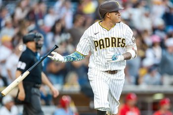 May 9, 2026; San Diego, California, USA; San Diego Padres third baseman Manny Machado (13) hits a one run home run during the eighth inning against the St. Louis Cardinals at Petco Park. Mandatory Credit: David Frerker-Imagn Images