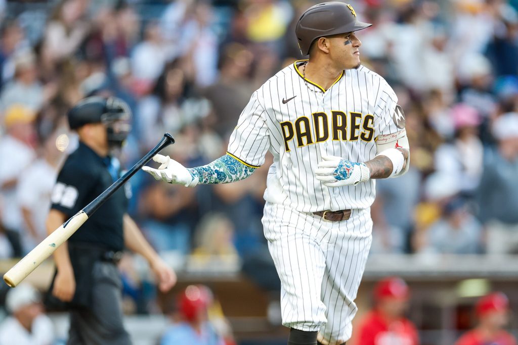 May 9, 2026; San Diego, California, USA; San Diego Padres third baseman Manny Machado (13) hits a one run home run during the eighth inning against the St. Louis Cardinals at Petco Park. Mandatory Credit: David Frerker-Imagn Images