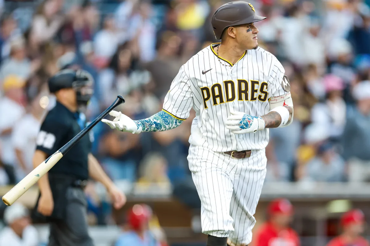 May 9, 2026; San Diego, California, USA; San Diego Padres third baseman Manny Machado (13) hits a one run home run during the eighth inning against the St. Louis Cardinals at Petco Park. Mandatory Credit: David Frerker-Imagn Images