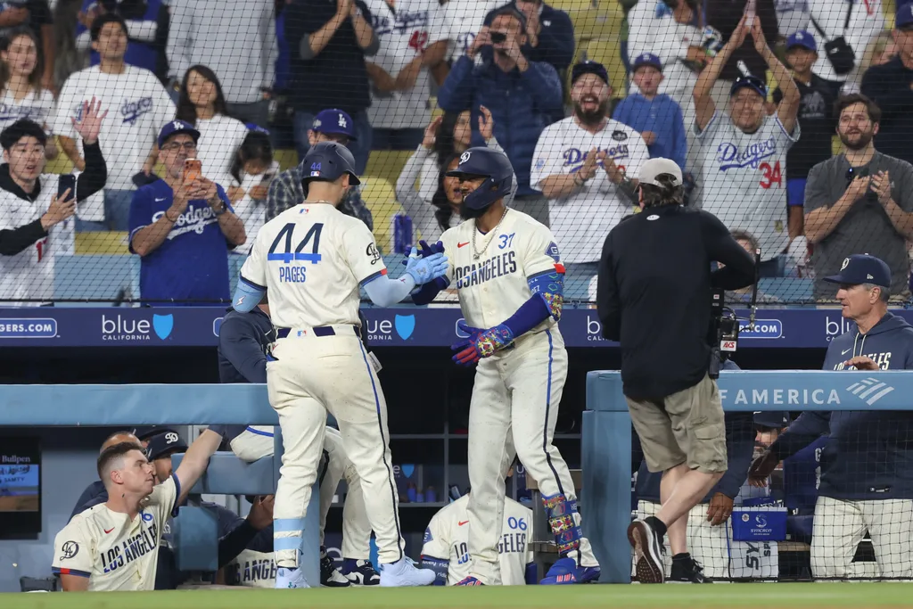 May 9, 2026; Los Angeles, California, USA; Los Angeles Dodgers center fielder Andy Pages (44) is greeted at the dugout steps by left fielder Teoscar Hernández (37) after hitting two-run home run against the Atlanta Braves two-run home run at Dodger Stadium. Mandatory Credit: Kiyoshi Mio-Imagn Images