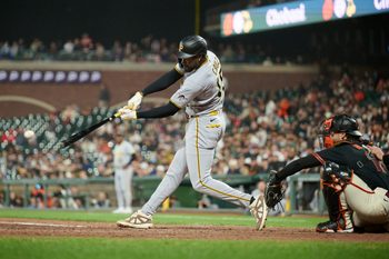 May 9, 2026; San Francisco, California, USA; Pittsburgh Pirates outfielder Oneil Cruz (15) hits a single against the San Francisco Giants during the ninth inning at Oracle Park. Mandatory Credit: Robert Edwards-Imagn Images