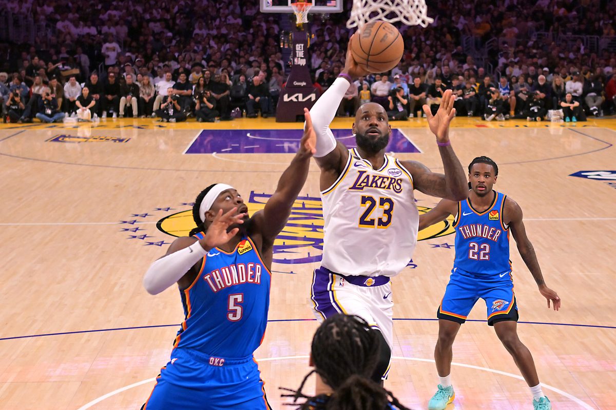 May 9, 2026; Los Angeles, California, USA; Los Angeles Lakers forward LeBron James (23) drives past Oklahoma City Thunder guard Luguentz Dort (5) during game three of the second round of the 2026 NBA Playoffs at Crypto.com Arena. Mandatory Credit: Jayne Kamin-Oncea-Imagn Images
