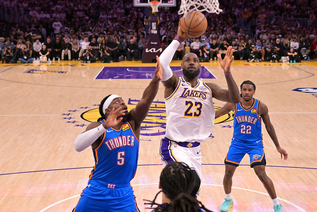 May 9, 2026; Los Angeles, California, USA; Los Angeles Lakers forward LeBron James (23) drives past Oklahoma City Thunder guard Luguentz Dort (5) during game three of the second round of the 2026 NBA Playoffs at Crypto.com Arena. Mandatory Credit: Jayne Kamin-Oncea-Imagn Images