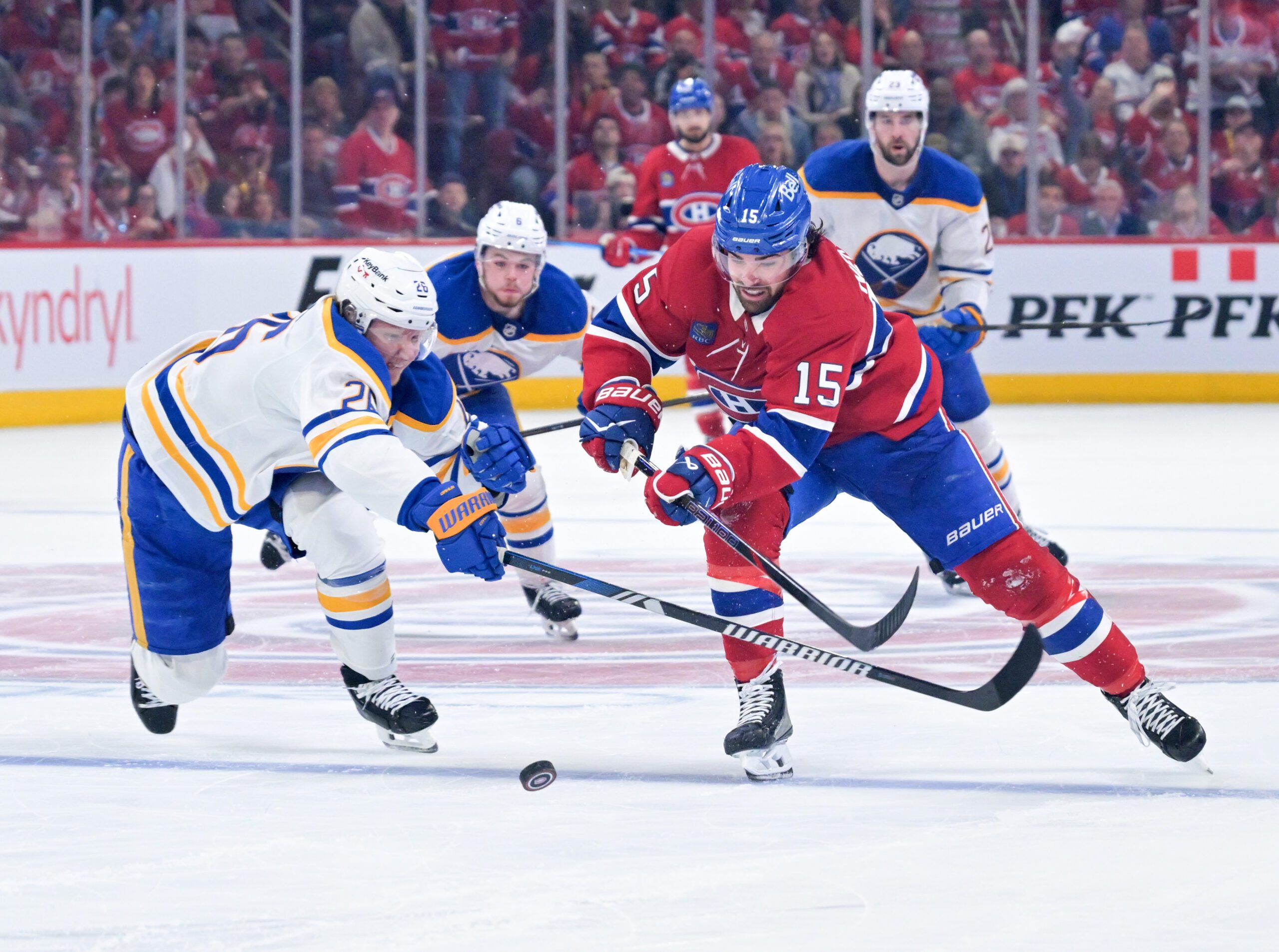 May 10, 2026; Montreal, Quebec, CAN; Montreal Canadiens forward Alex Newhook (15) on his way to score an empty net goal and Buffalo Sabres defenseman Rasmus Dahlin (26) defending during the third period in game three of the second round of the 2026 Stanley Cup Playoffs at the Bell Centre. Mandatory Credit: Eric Bolte-Imagn Images