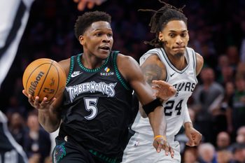 May 10, 2026; Minneapolis, Minnesota, USA; Minnesota Timberwolves guard Anthony Edwards (5) goes to the basket past San Antonio Spurs guard Devin Vassell (24) in the fourth quarter of game four of the second round of the 2026 NBA Playoffs at Target Center. Mandatory Credit: Bruce Kluckhohn-Imagn Images