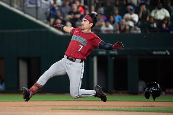 May 11, 2026; Arlington, Texas, USA;  Arizona Diamondbacks right fielder Corbin Carroll (7) slides into second base with a double against the Texas Rangers during the first inning at Globe Life Field. Mandatory Credit: Raymond Carlin III-Imagn Images