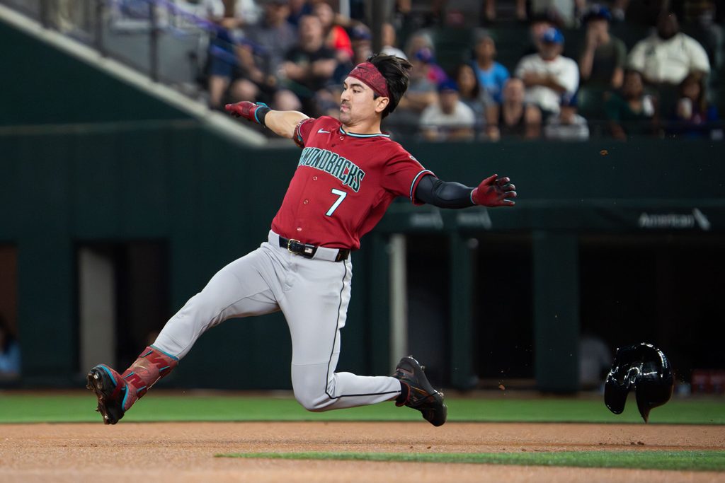 May 11, 2026; Arlington, Texas, USA; Arizona Diamondbacks right fielder Corbin Carroll (7) slides into second base with a double against the Texas Rangers during the first inning at Globe Life Field. Mandatory Credit: Raymond Carlin III-Imagn Images