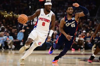 May 11, 2026; Cleveland, Ohio, USA; Detroit Pistons guard Caris LeVert (8) brings the ball up court against Cleveland Cavaliers guard Donovan Mitchell (45) during the first half of game four in the second round of the 2026 NBA Playoffs at Rocket Arena. Mandatory Credit: Ken Blaze-Imagn Images