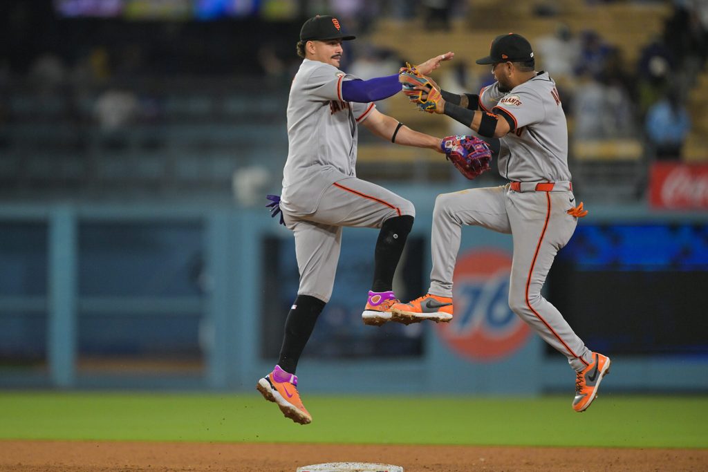 May 11, 2026; Los Angeles, California, USA; San Francisco Giants shortstop Willy Adames (2) and second baseman Luis Arraez (1) celebrate after defeating the Los Angeles Dodgers at Dodger Stadium. Mandatory Credit: Jayne Kamin-Oncea-Imagn Images