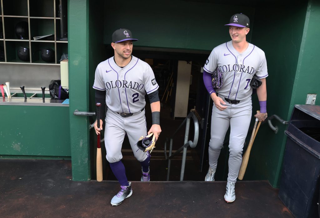May 12, 2026; Pittsburgh, Pennsylvania, USA; Colorado Rockies right fielder Tyler Freeman (2) and first baseman TJ Rumfield (7) enter the dugout to play the Pittsburgh Pirates at PNC Park. Mandatory Credit: Charles LeClaire-Imagn Images