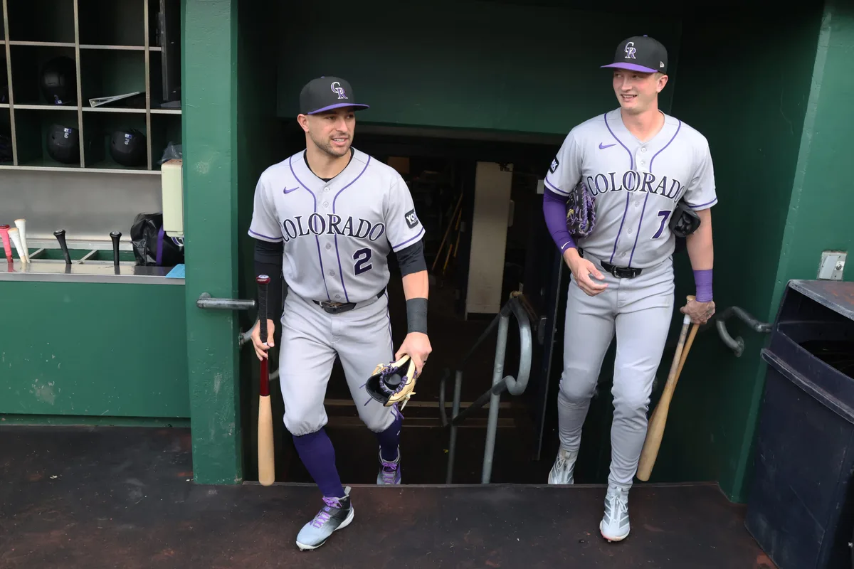 May 12, 2026; Pittsburgh, Pennsylvania, USA; Colorado Rockies right fielder Tyler Freeman (2) and first baseman TJ Rumfield (7) enter the dugout to play the Pittsburgh Pirates at PNC Park. Mandatory Credit: Charles LeClaire-Imagn Images