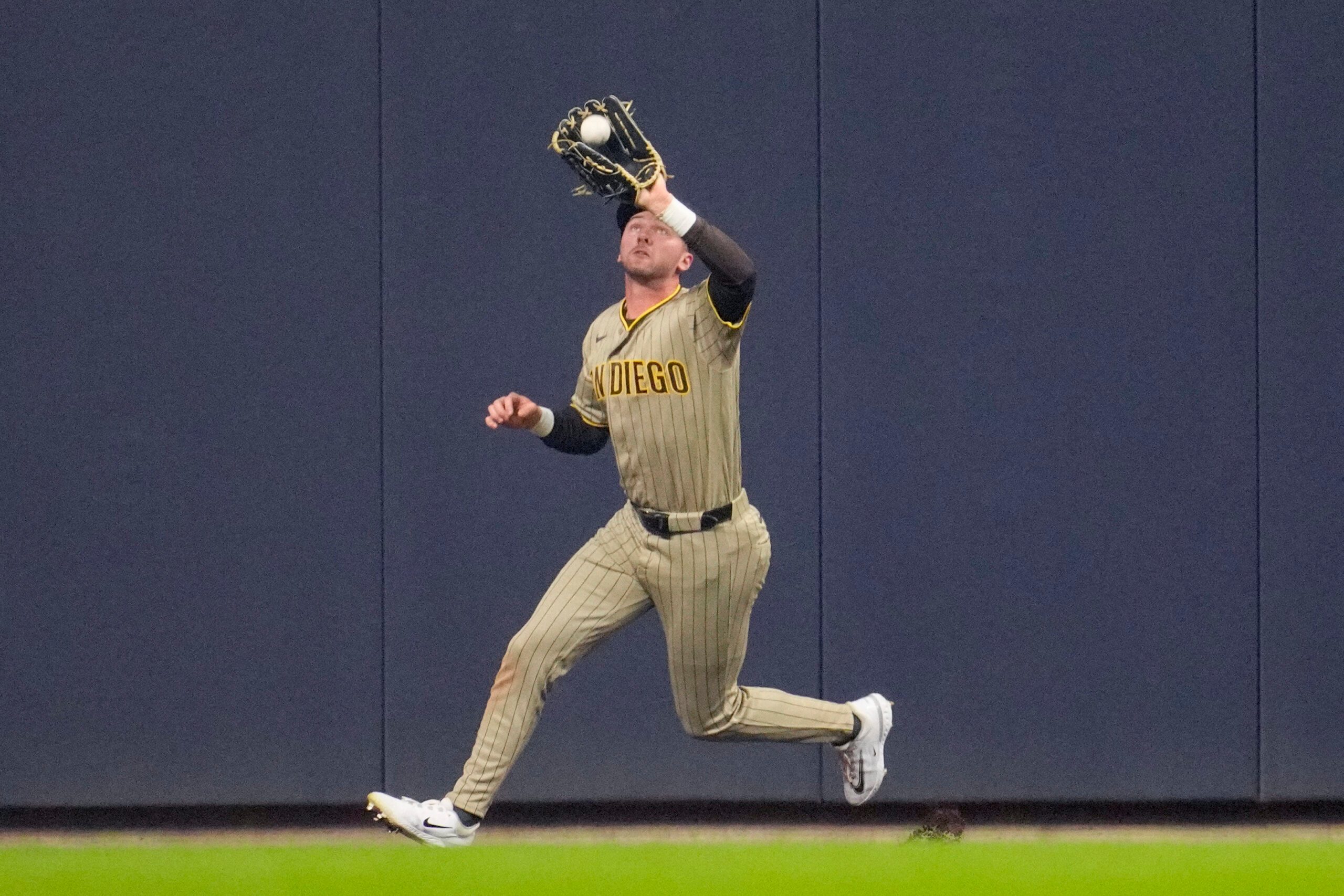 May 12, 2026; Milwaukee, Wisconsin, USA; San Diego Padres center fielder Jackson Merrill (3) catches a fly ball against the Milwaukee Brewers in the fourth inning at American Family Field. Mandatory Credit: Michael McLoone-Imagn Images