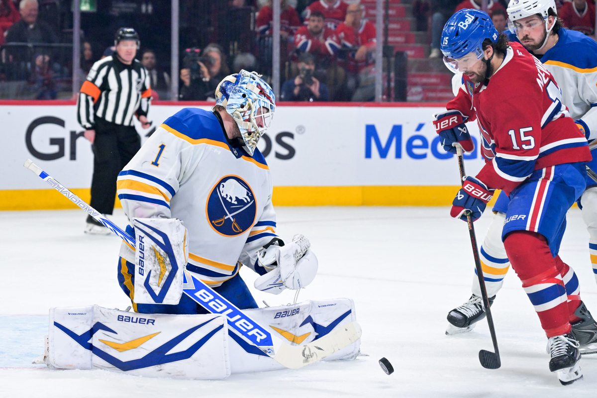 May 12, 2026; Montreal, Quebec, CAN; Buffalo Sabres goalie Ukko-Pekka Luukkonen (1) stops Montreal Canadiens forward Alex Newhook (15) during the third period in game four of the second round of the 2026 Stanley Cup Playoffs at Bell Centre. Mandatory Credit: Eric Bolte-Imagn Images