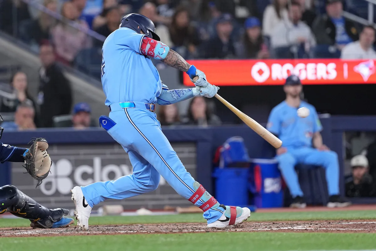 May 12, 2026; Toronto, Ontario, CAN; Toronto Blue Jays left fielder Yohendrick Pinango (24) hits a two run double against the Tampa Bay Rays during the seventh inning at Rogers Centre. Mandatory Credit: Nick Turchiaro-Imagn Images