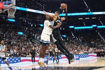 May 12, 2026; San Antonio, Texas, USA; San Antonio Spurs forward Victor Wembanyama (1) drives to the basket against Minnesota Timberwolves center Naz Reid (11) during the second half of game five of the second round of the 2026 NBA Playoffs at Frost Bank Center. Mandatory Credit: Scott Wachter-Imagn Images