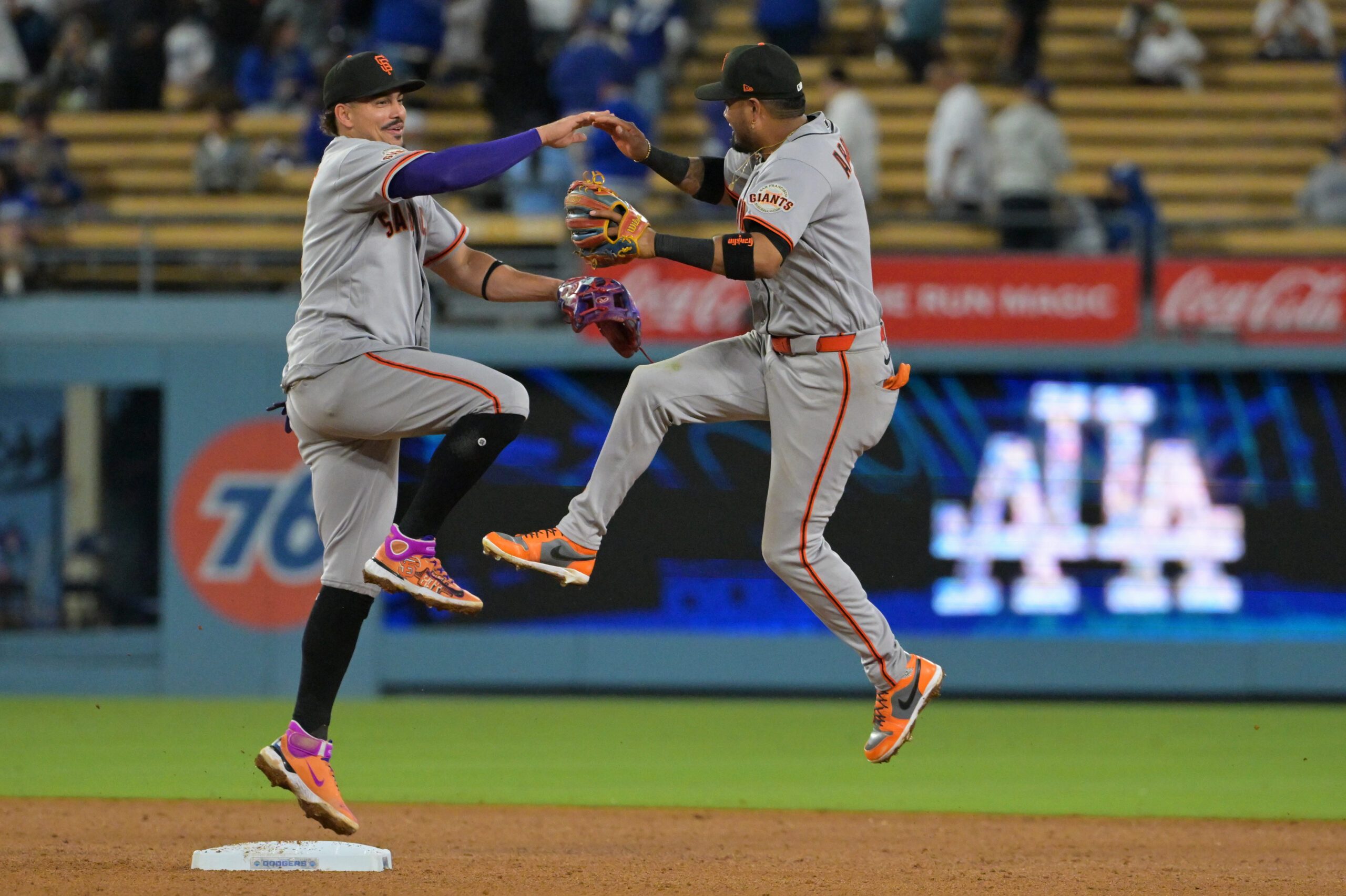 May 12, 2026; Los Angeles, California, USA; San Francisco Giants shortstop Willy Adames (2) and second baseman Luis Arraez (1) celebrate after defeating the Los Angeles Dodgers in the ninth inning at Dodger Stadium. Mandatory Credit: Jayne Kamin-Oncea-Imagn Images