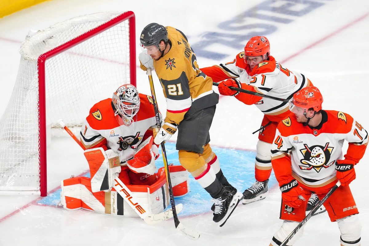 May 12, 2026; Las Vegas, Nevada, USA; Anaheim Ducks goaltender Lukas Dostal (1) makes a save as defenseman Olen Zellweger (51) checks Vegas Golden Knights center Brett Howden (21) during an overtime period in game five of the second round of the 2026 Stanley Cup Playoffs at T-Mobile Arena. Mandatory Credit: Stephen R. Sylvanie-Imagn Images