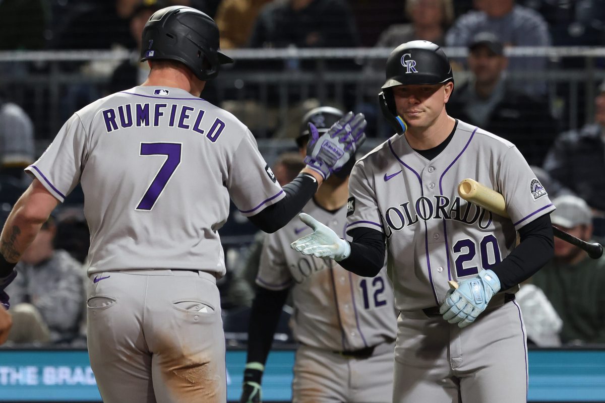 May 13, 2026; Pittsburgh, Pennsylvania, USA;  Colorado Rockies first baseman TJ Rumfield (7) celebrates his solo home run with designated hitter Troy Johnston (20) against the Pittsburgh Pirates during the eighth inning at PNC Park. Mandatory Credit: Charles LeClaire-Imagn Images