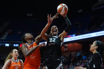 May 13, 2026; Uncasville, Connecticut, USA; Las Vegas Aces center A'ja Wilson (22) shoots the ball against Connecticut Sun forward Diamond Miller (1) in the second half at Mohegan Sun Arena. Mandatory Credit: David Butler II-Imagn Images