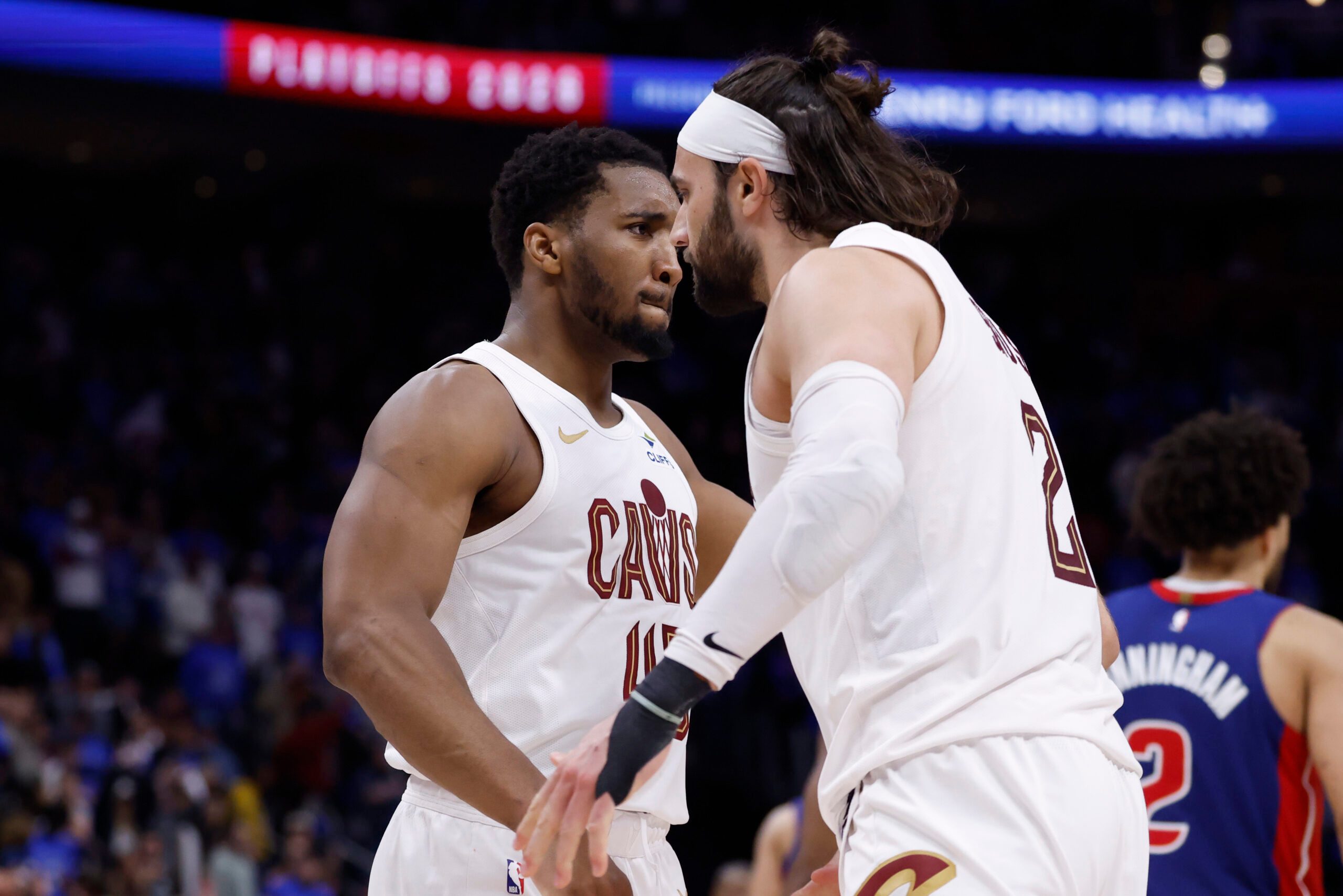 May 13, 2026; Detroit, Michigan, USA; Cleveland Cavaliers guard Donovan Mitchell (45) and guard/forward Max Strus (2) celebrates in overtime against the Detroit Pistons during game five of the second round of the 2026 NBA Playoffs at Little Caesars Arena. Mandatory Credit: Rick Osentoski-Imagn Images