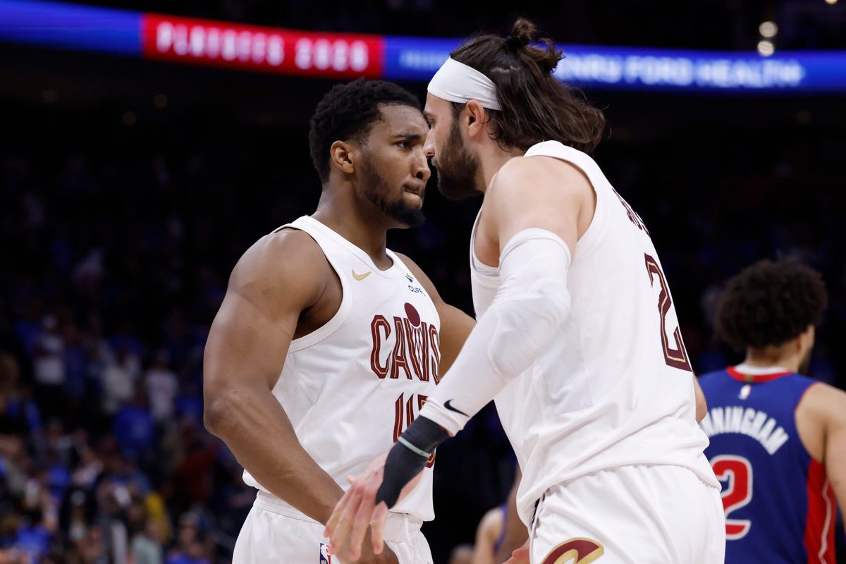 May 13, 2026; Detroit, Michigan, USA; Cleveland Cavaliers guard Donovan Mitchell (45) and guard/forward Max Strus (2) celebrates in overtime against the Detroit Pistons during game five of the second round of the 2026 NBA Playoffs at Little Caesars Arena. Mandatory Credit: Rick Osentoski-Imagn Images