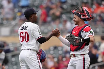 May 14, 2026; Minneapolis, Minnesota, USA; Minnesota Twins pitcher Kendry Rojas (60) and catcher Ryan Jeffers (27) celebrate after defeating the Miami Marlins at Target Field. Mandatory Credit: Jordan Johnson-Imagn Images