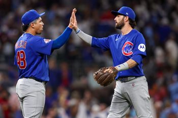May 14, 2026; Atlanta, Georgia, USA; Chicago Cubs pitcher Daniel Palencia (48) and shortstop Dansby Swanson (7) celebrate after a victory over the Atlanta Braves at Truist Park. Mandatory Credit: Brett Davis-Imagn Images