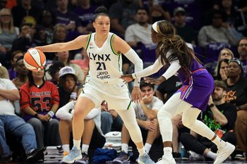 May 12, 2026; Phoenix, Arizona, USA; Minnesota Lynx guard Kayla McBride (21) against the Phoenix Mercury at Mortgage Matchup Center. Mandatory Credit: Mark J. Rebilas-Imagn Images