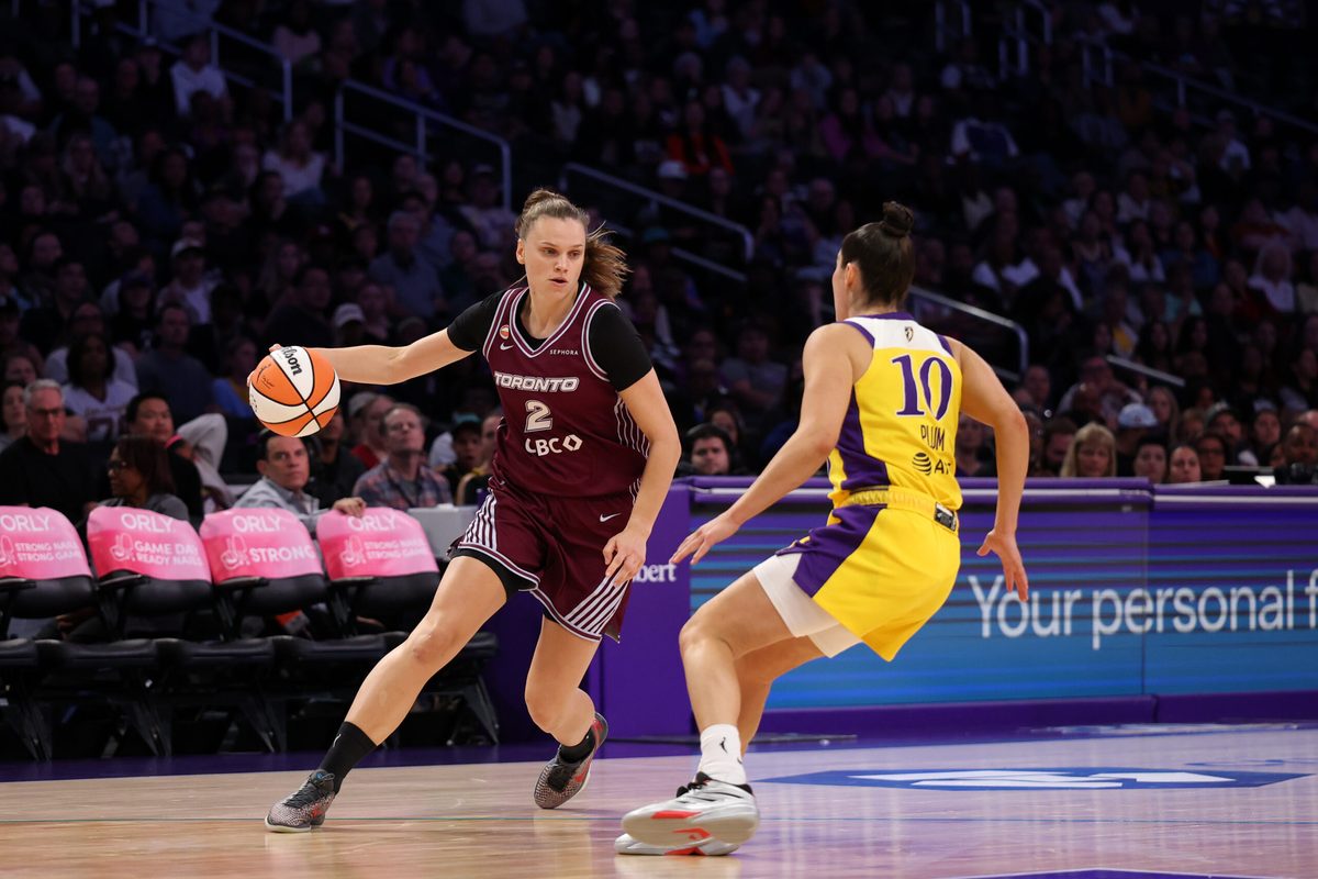 May 15, 2026; Los Angeles, California, USA;  Toronto Tempo forward Laura Juskaite (2) dribbles the ball against Los Angeles Sparks guard Kelsey Plum (10) during the second quarter at Crypto.com Arena. Mandatory Credit: Kiyoshi Mio-Imagn Images