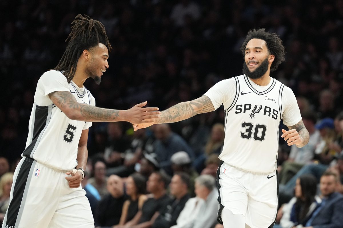 May 15, 2026; Minneapolis, Minnesota, USA; San Antonio Spurs forward Julian Champagnie (30) celebrates with guard Stephon Castle (5) in the second half against the Minnesota Timberwolves during game six of the second round of the 2026 NBA Playoffs at Target Center. Mandatory Credit: Jesse Johnson-Imagn Images