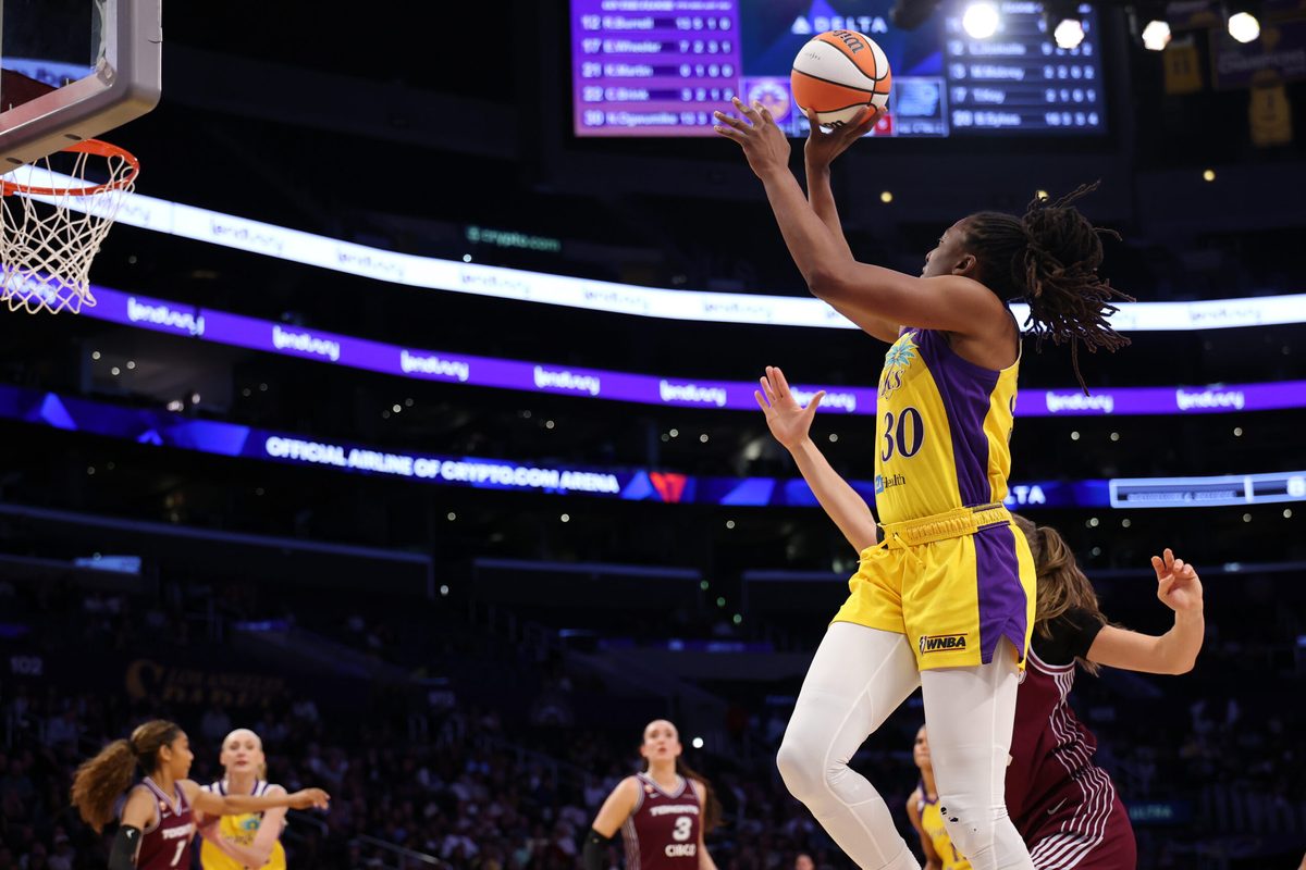 May 15, 2026; Los Angeles, California, USA;  Los Angeles Sparks forward Nneka Ogwumike (30) shoots the ball past Toronto Tempo forward Laura Juskaite (2) during the third quarter at Crypto.com Arena. Mandatory Credit: Kiyoshi Mio-Imagn Images