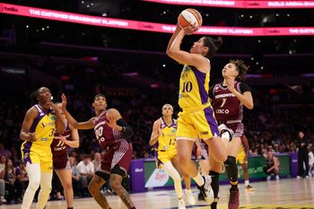 May 15, 2026; Los Angeles, California, USA;  Los Angeles Sparks guard Kelsey Plum (10) shoots the ball past Toronto Tempo guard Kiki Rice (1) during the fourth quarter at Crypto.com Arena. Mandatory Credit: Kiyoshi Mio-Imagn Images