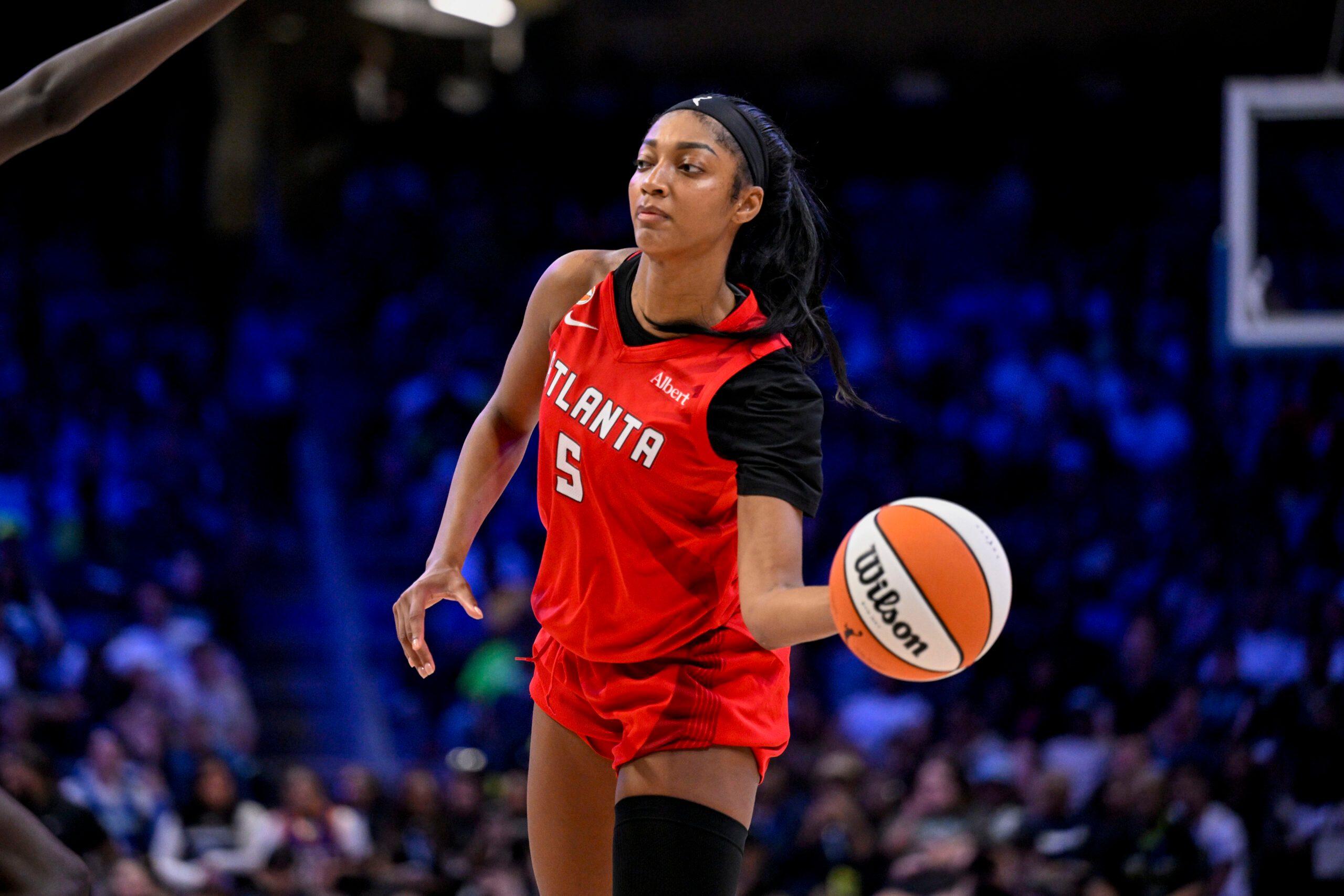 May 12, 2026; Arlington, Texas, USA; Atlanta Dream forward Angel Reese (5) passes the ball during the game between the Wings and the Dream at College Park Center. Mandatory Credit: Jerome Miron-Imagn Images