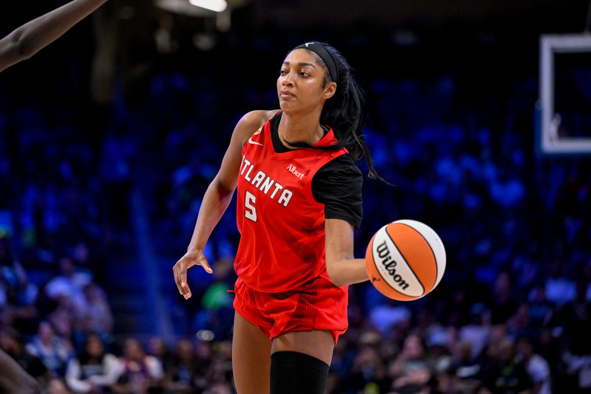 May 12, 2026; Arlington, Texas, USA; Atlanta Dream forward Angel Reese (5) passes the ball during the game between the Wings and the Dream at College Park Center. Mandatory Credit: Jerome Miron-Imagn Images