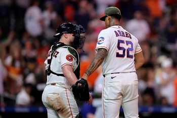 May 16, 2026; Houston, Texas, USA; Houston Astros pitcher Bryan Abreu (52) and catcher Christian Vasquez (2) congratulate each other after the final out against the Texas Rangers during the ninth inning at Daikin Park. Mandatory Credit: Erik Williams-Imagn Images