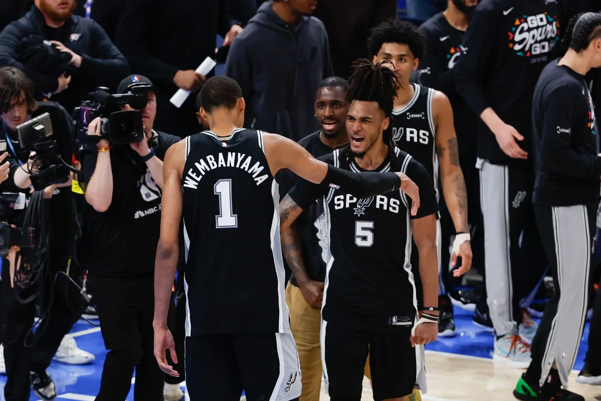 May 18, 2026; Oklahoma City, Oklahoma, USA; San Antonio Spurs center Victor Wembanyama (1) celebrates with San Antonio Spurs guard Stephon Castle (5) after defeating the Oklahoma City Thunder in double overtime against during game one of the western conference finals for the 2026 NBA playoffs at Paycom Center. Mandatory Credit: Alonzo Adams-Imagn Images