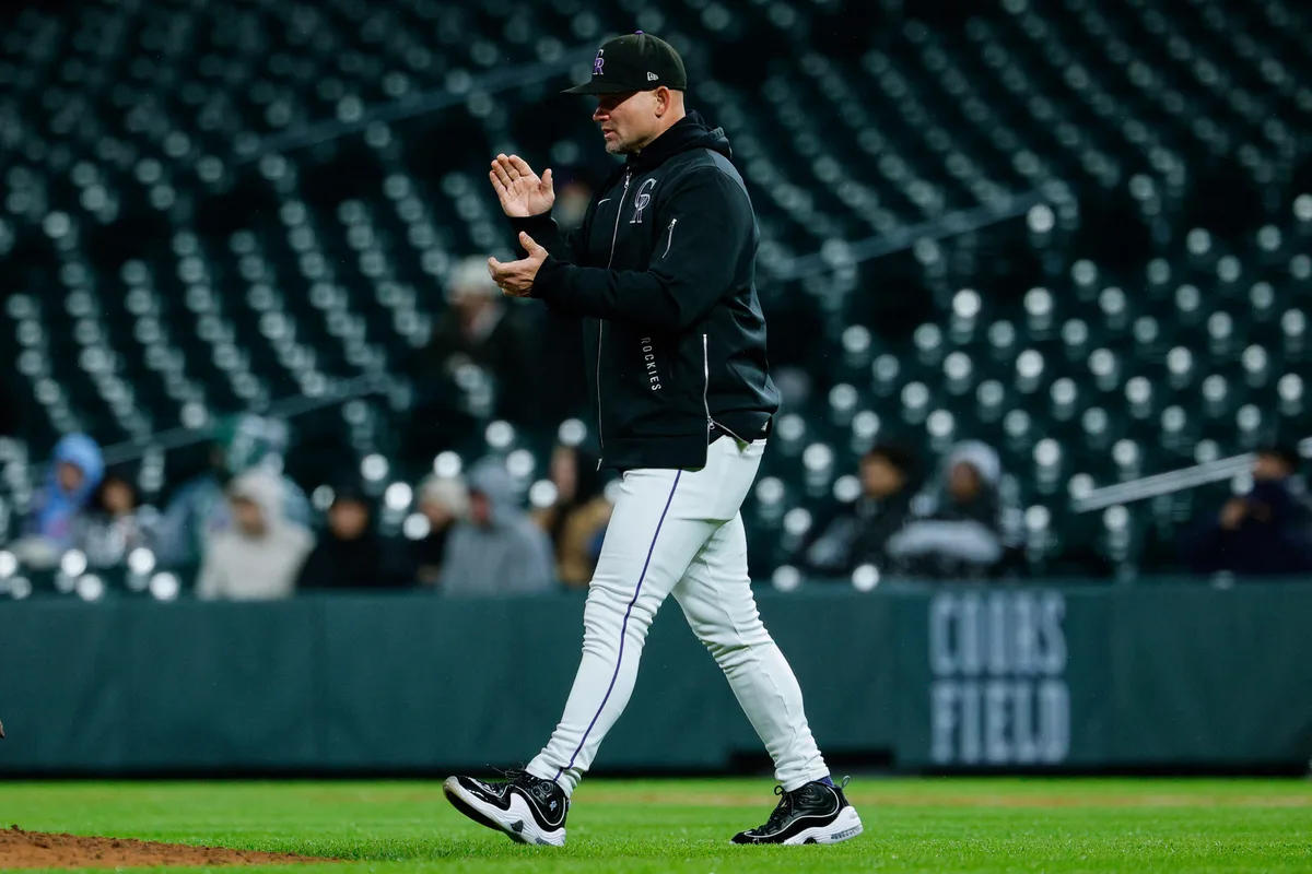 May 18, 2026; Denver, Colorado, USA; Colorado Rockies manager Warren Schaeffer (4) walks to the mound for a pitching change in the fifth inning against the Texas Rangers at Coors Field. Mandatory Credit: Isaiah J. Downing-Imagn Images