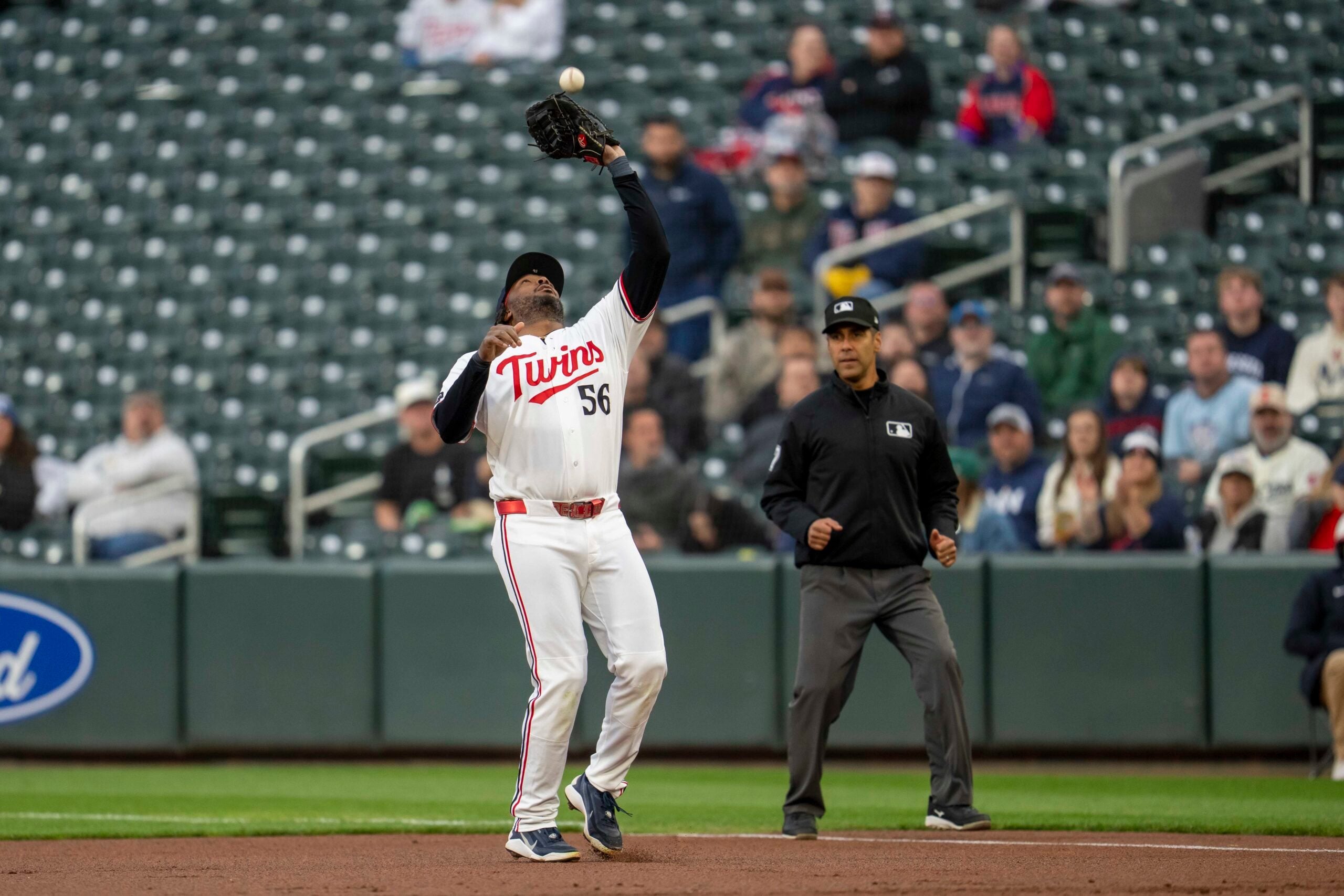 May 19, 2026; Minneapolis, Minnesota, USA; Minnesota Twins first baseman Josh Bell (56) catches a fly ball against the Houston Astros in the first inning at Target Field. Mandatory Credit: Jesse Johnson-Imagn Images