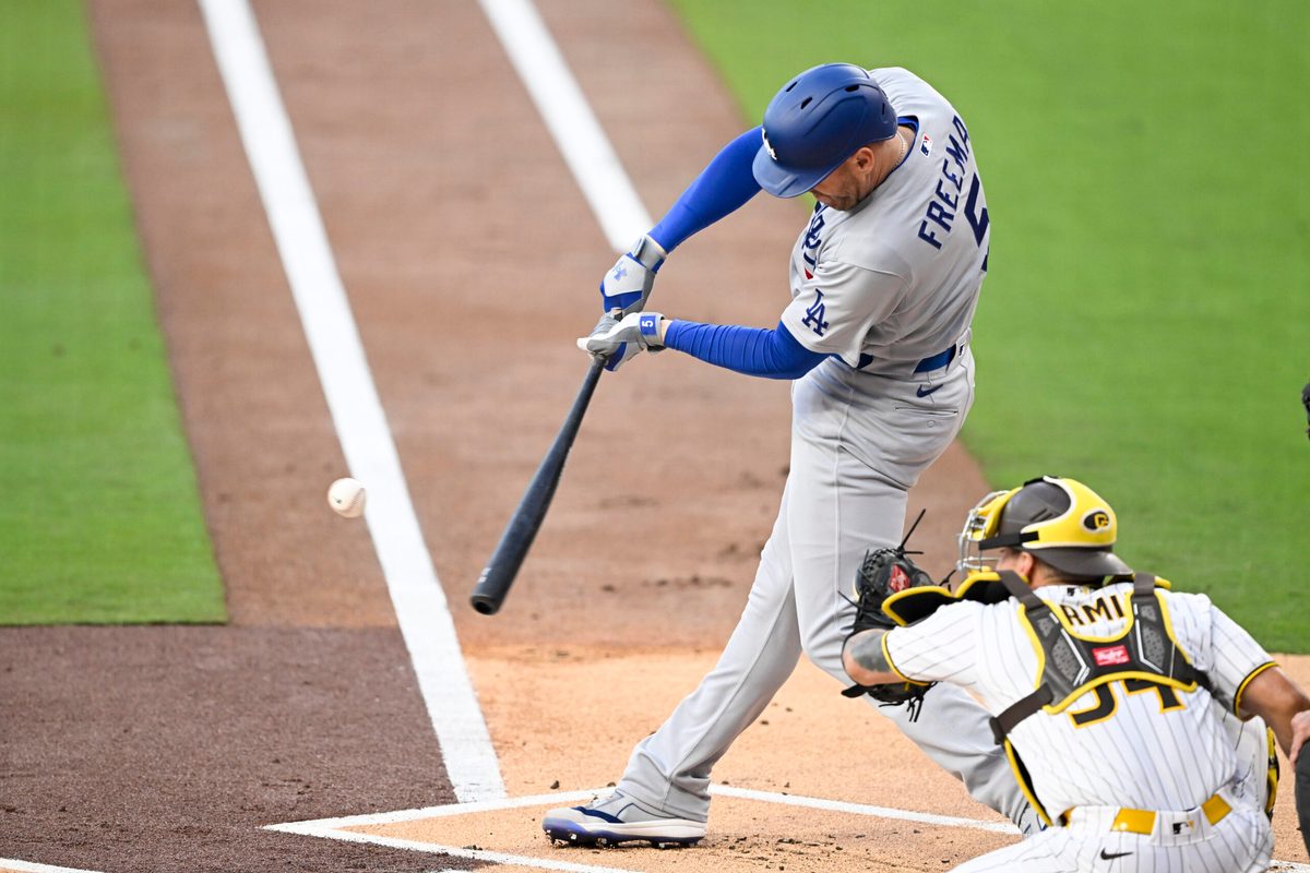 May 19, 2026; San Diego, California, USA; Los Angeles Dodgers first baseman Freddie Freeman (5) hits a two-run home run during the first inning against the San Diego Padres at Petco Park. Mandatory Credit: Denis Poroy-Imagn Images