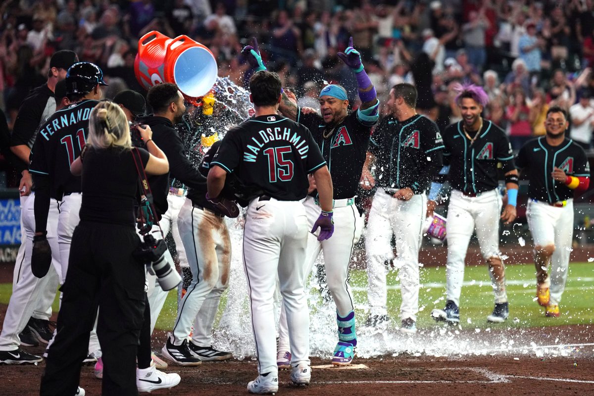 May 19, 2026; Phoenix, Arizona, USA; Arizona Diamondbacks second baseman Ketel Marte (4) is doused with water by teammates after hitting a three run walk off home run against the San Francisco Giants during the ninth inning at Chase Field. Mandatory Credit: Joe Camporeale-Imagn Images