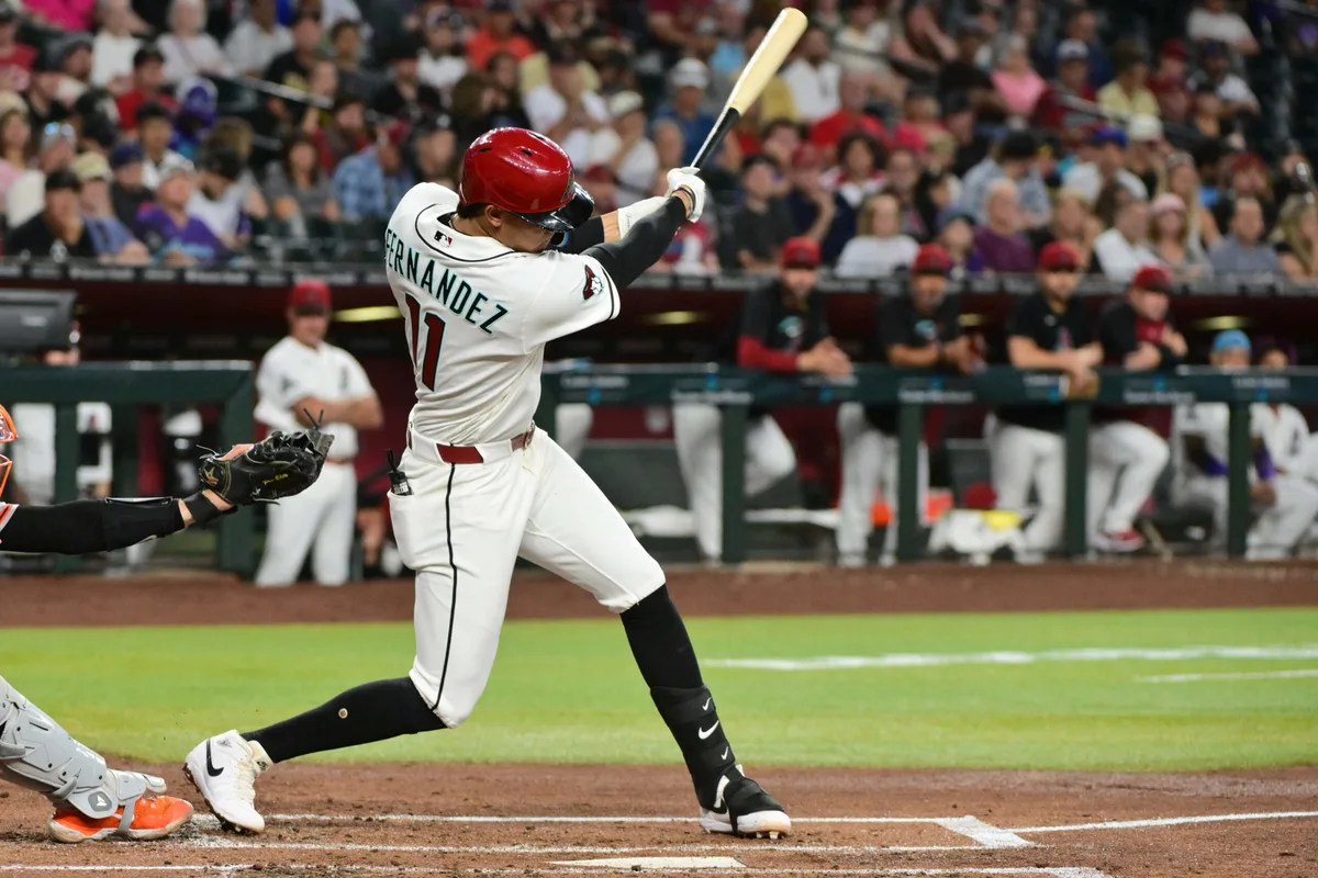 May 20, 2026; Phoenix, Arizona, USA; Arizona Diamondbacks designated hitter Jose Fernandez (11) singles in the second inning against the San Francisco Giants at Chase Field. Mandatory Credit: Matt Kartozian-Imagn Images