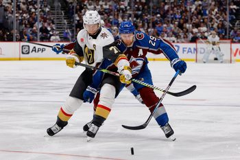 May 20, 2026; Denver, Colorado, USA; Vegas Golden Knights center William Karlsson (71) and Colorado Avalanche center Nathan MacKinnon (29) battle for the puck during the third period in game one of the Western Conference Final of the 2026 Stanley Cup Playoffs at Ball Arena. Mandatory Credit: Isaiah J. Downing-Imagn Images