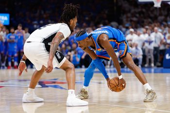 May 20, 2026; Oklahoma City, Oklahoma, USA; Oklahoma City Thunder guard Shai Gilgeous-Alexander (2) looks to pass as San Antonio Spurs guard Stephon Castle (5) defends during the fourth quarter during game two of the western conference finals for the 2026 NBA playoffs at Paycom Center. Mandatory Credit: Alonzo Adams-Imagn Images