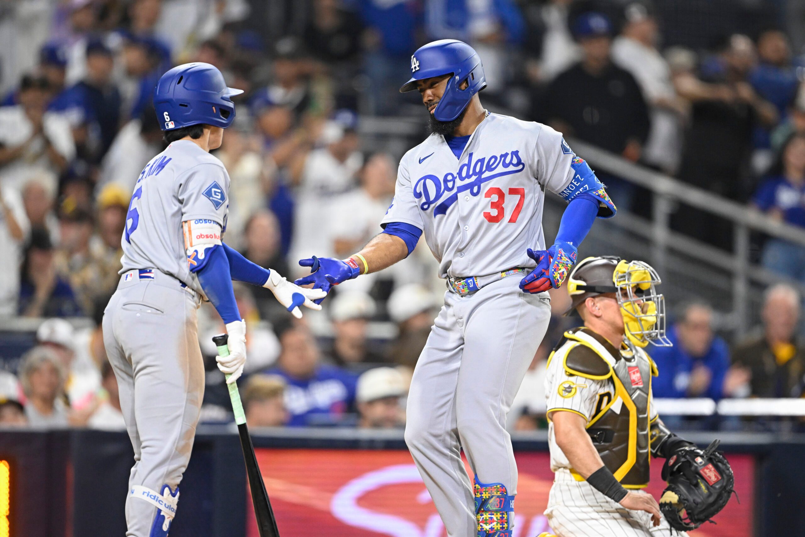 May 20, 2026; San Diego, California, USA; Los Angeles Dodgers left fielder Teoscar Hernandez (37) is congratulated by second baseman Hyeseong Kim (6) after hitting a solo home run during the ninth inning against the San Diego Padres at Petco Park. Mandatory Credit: Denis Poroy-Imagn Images