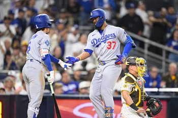 May 20, 2026; San Diego, California, USA; Los Angeles Dodgers left fielder Teoscar Hernandez (37) is congratulated by second baseman Hyeseong Kim (6) after hitting a solo home run during the ninth inning against the San Diego Padres at Petco Park. Mandatory Credit: Denis Poroy-Imagn Images