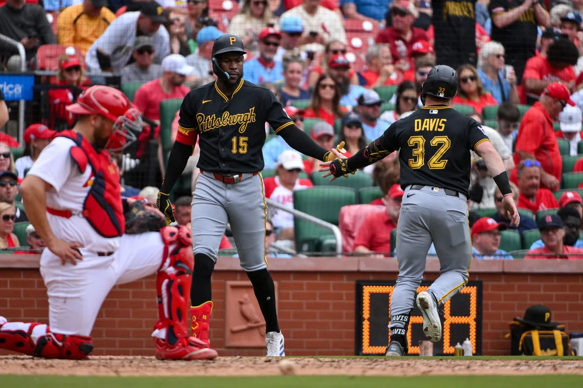 May 21, 2026; St. Louis, Missouri, USA; Pittsburgh Pirates catcher Henry Davis (32) is congratulated by center fielder Oneil Cruz (15) after hitting a solo home run against the St. Louis Cardinals during the seventh inning at Busch Stadium. Mandatory Credit: Jeff Curry-Imagn Images