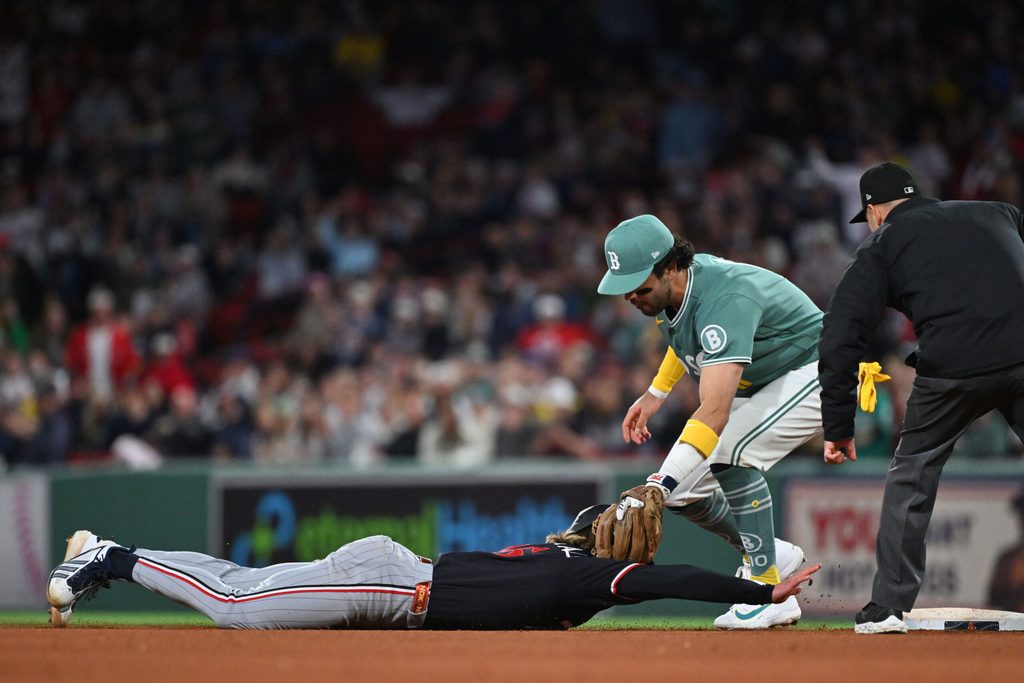 May 22, 2026; Boston, Massachusetts, USA; Minnesota Twins second baseman Luke Keaschall (15) is tagged out by Boston Red Sox second baseman Marcelo Mayer (11) during the eighth inning at Fenway Park. Mandatory Credit: Eric Canha-Imagn Images
